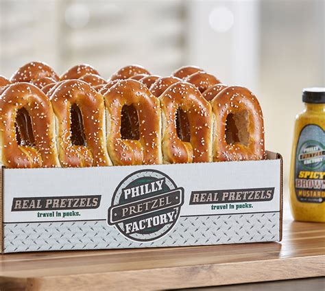 Philly pretzle factory - Whisk together yeast, warm water, salt, sugar, and melted butter. Use a mixer to add the flour. The dough should have a bouncy consistency. 2. Knead and roll out into log strands. Create pretzel ...